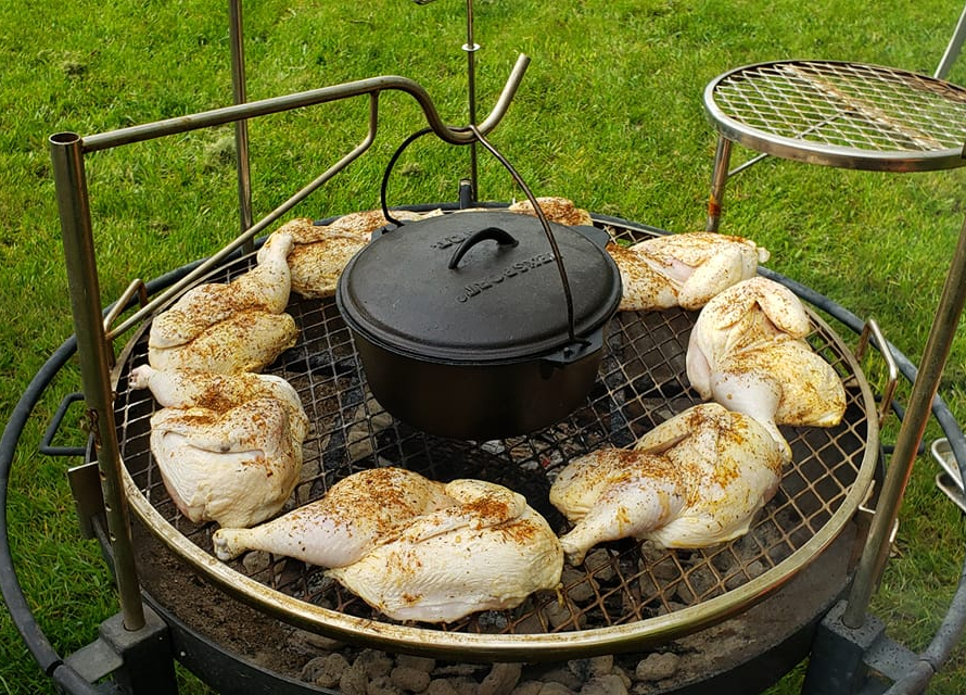 Chicken on a grill with a Dutch Oven